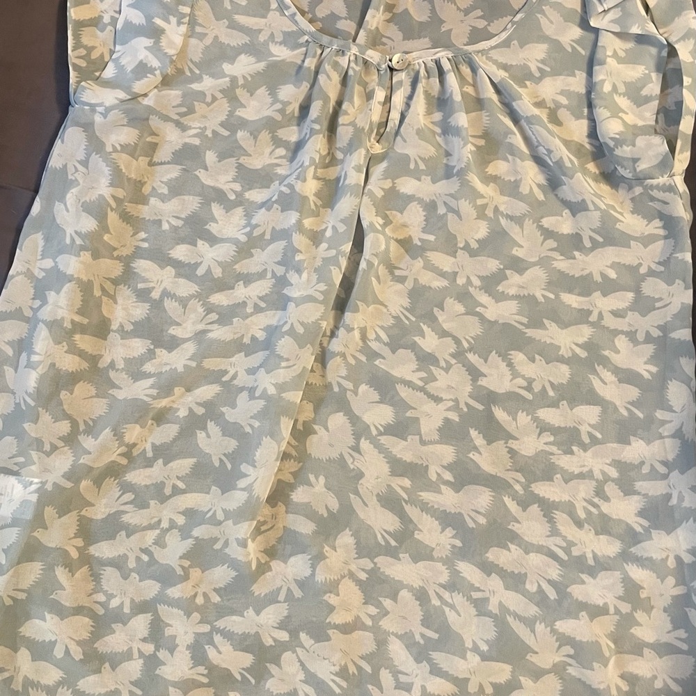 Gently used white birds with lite blue blouse